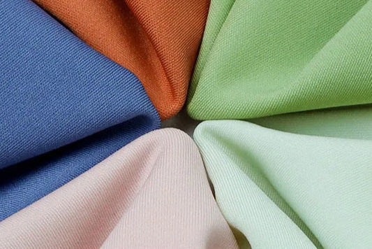 Colorful fabric materials showing Diguan’s flexible supply chain and fabric options.